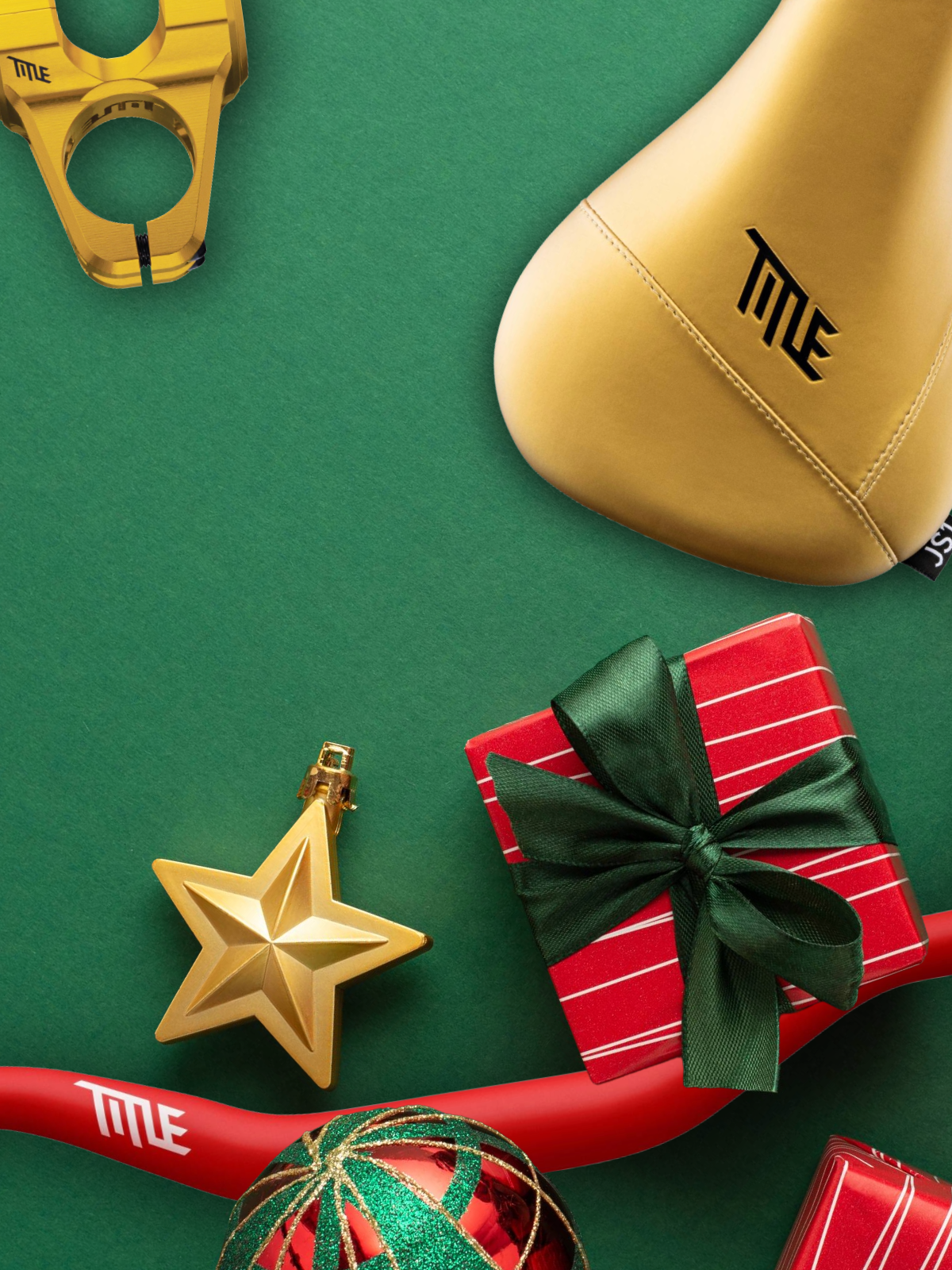 Red and green gift boxes with ribbons on a green surface