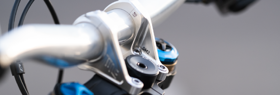 Close up of mountain bike stem from Title MTB with DM2 branding