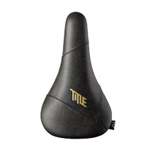 Black bicycle seat with gold 'Title' logo on a white background