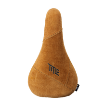 Brown bicycle seat with 'Title' branding on a white background