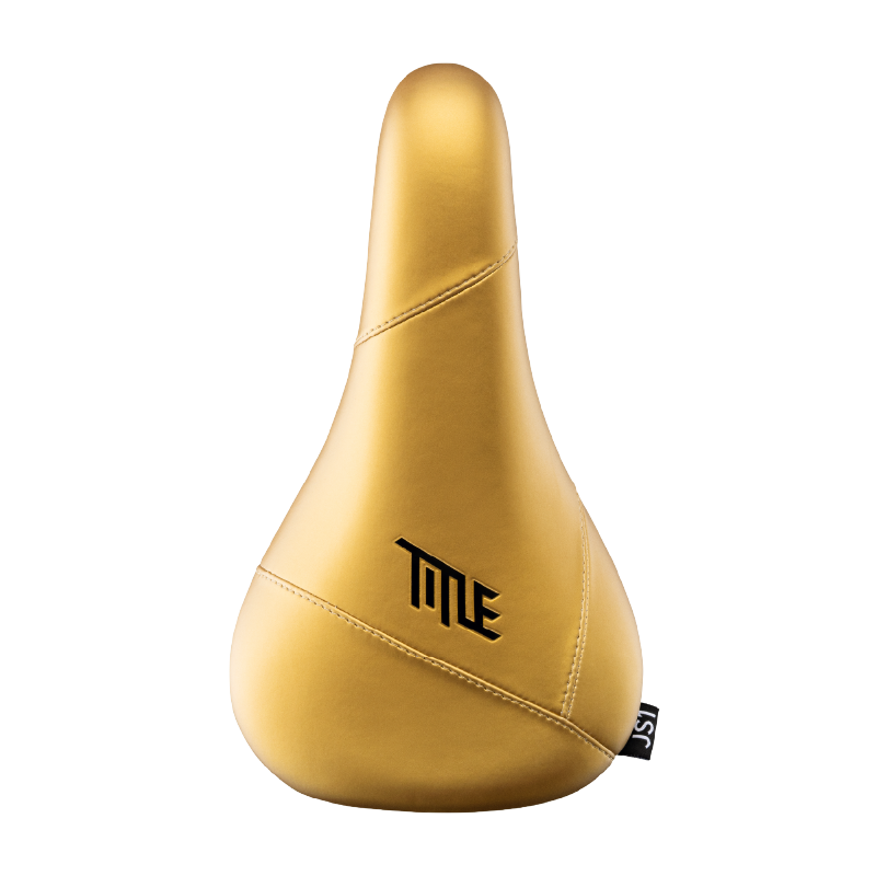 Gold bicycle seat with 'TITLE' branding on a white background