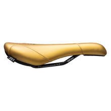 Gold bicycle seat on a white background