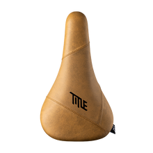 Brown bicycle seat with 'TITLE' logo on a white background