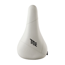 White bicycle seat with 'TITLE' logo on a white background