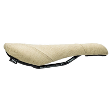 Beige bicycle saddle with black straps on a white background
