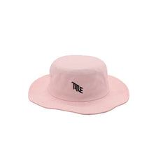 Pink bucket hat with 'TITLE' logo on a light gray background