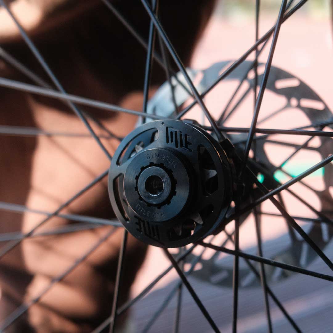 Close-up of a bicycle wheel with a focus on the gear mechanism.