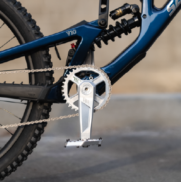 Close-up of a bicycle chain and gear system with a blurred background