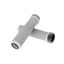 Pair of white bicycle handlebar grips with 'Title MTB' branding on a white background