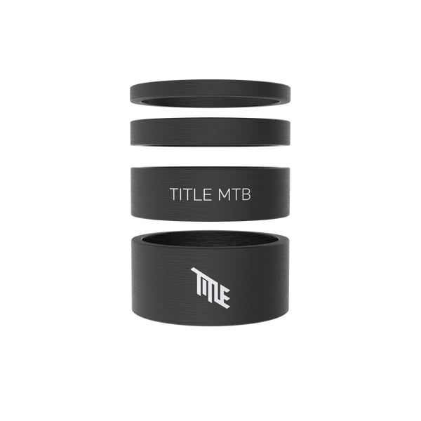 Black bicycle headset spacers with 'TITLE MTB' branding on a white background