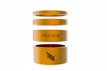 gold spacers with 'TITLE MTB' branding on a white background