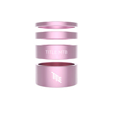 Pink spacers with 'TITLE MTB' branding on a white background